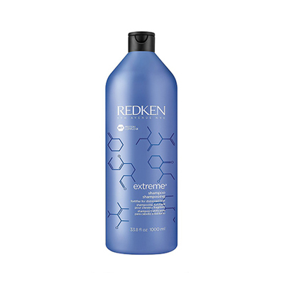 A bottle of redken 's hair conditioner.