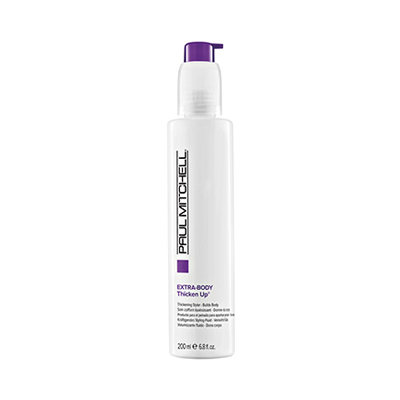 A bottle of hair styling product with purple cap.